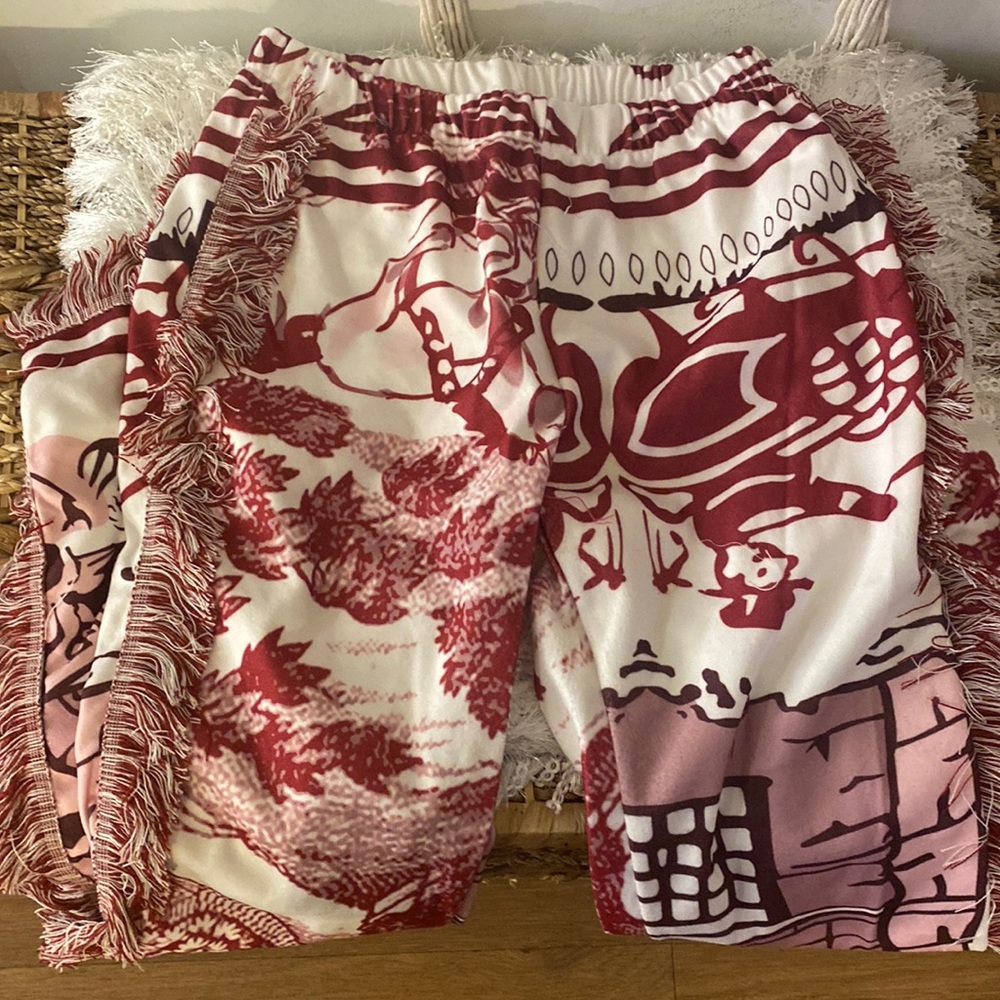Tribal print pants with side fringes